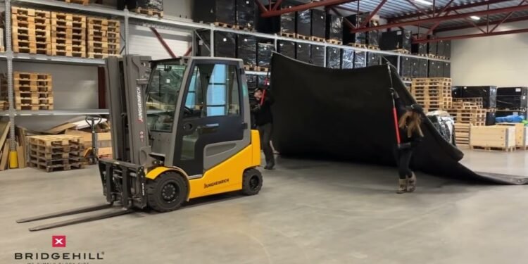 Isolate lithium forklift fires in seconds! | Bridgehill Forklift Hearth Blanket + Extendable Poles