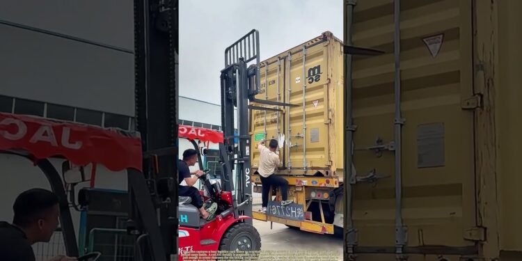 Forcing a Filled Container Close: Forklift Tines Cling the Door Whilst Staff Protected the Latch